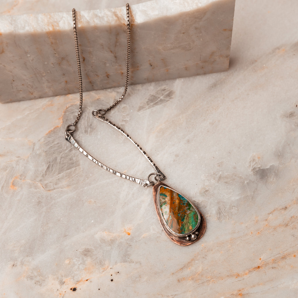 Rustic meets refined: Dive into the details of our handcrafted Peruvian Blue Opal Pendant Necklace. #ArtisanJewelry #OpalElegance