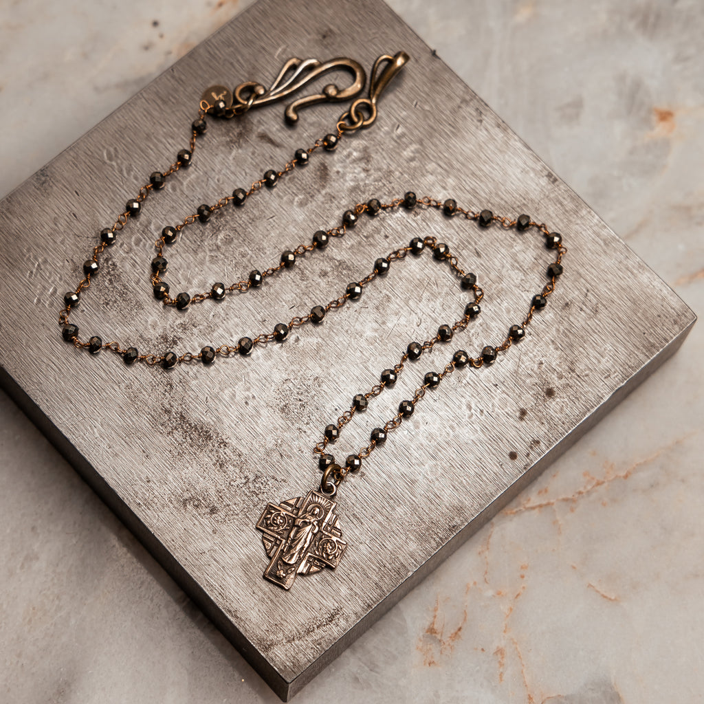 Elegant bronze cross medal necklace with pyrite beads