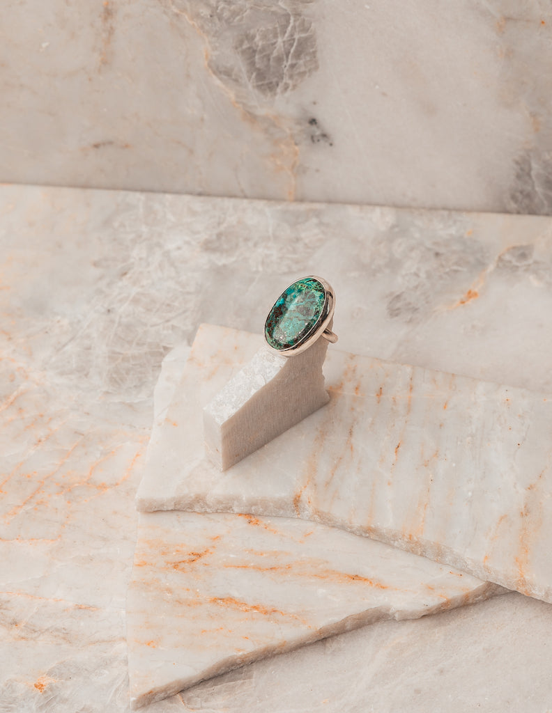 A striking blend of vivid blue-green Chrysocolla gemstone and sterling silver. Discover the allure of this statement ring in size 8. #ChrysocollaJewelry #StatementRing #GemstoneFashion