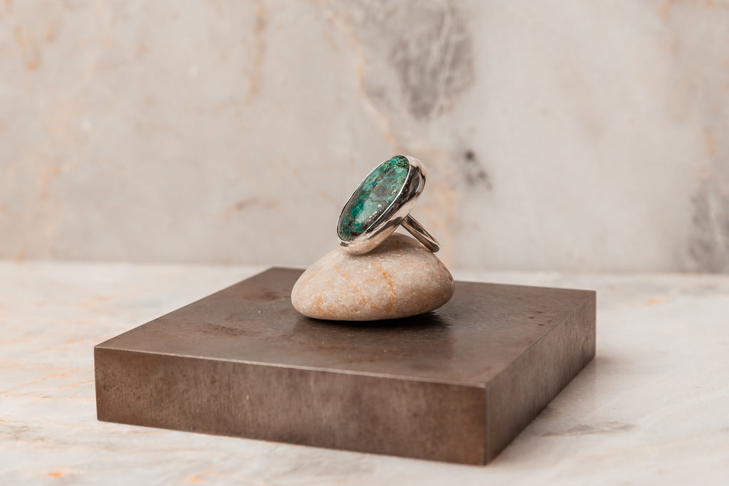 Gemstone Glamour: Embrace the allure of our Rowan Ring featuring a stunning Chrysocolla gemstone. Sterling silver craftsmanship in a statement piece, available in size 8. #GemstoneFashion