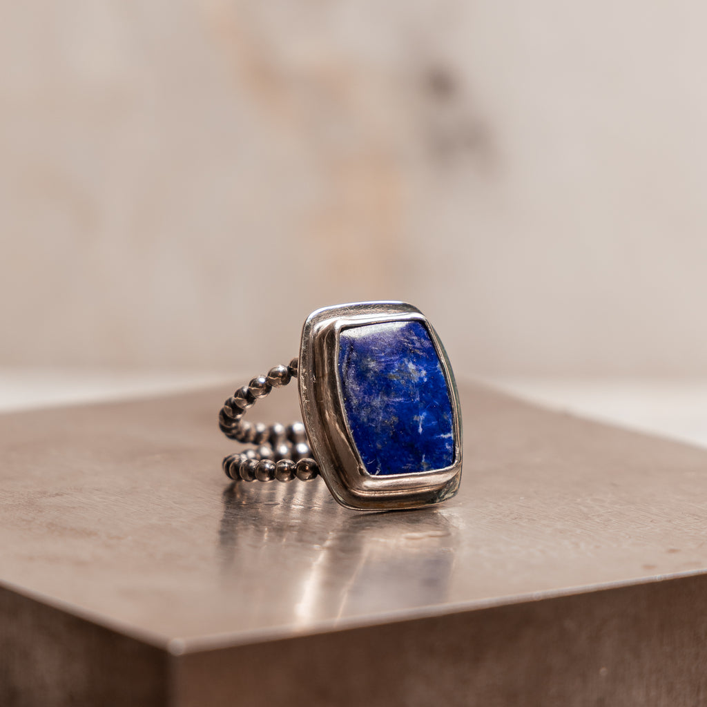 Bold artisan lapis lazuli ring with double beaded sterling silver band for modern statement style