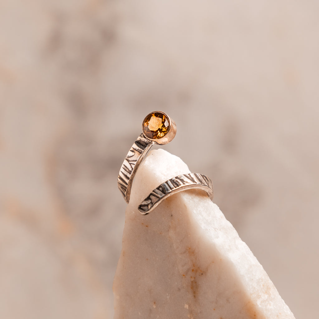 Handcrafted citrine ring – 14k gold setting on embossed sterling silver adjustable band.