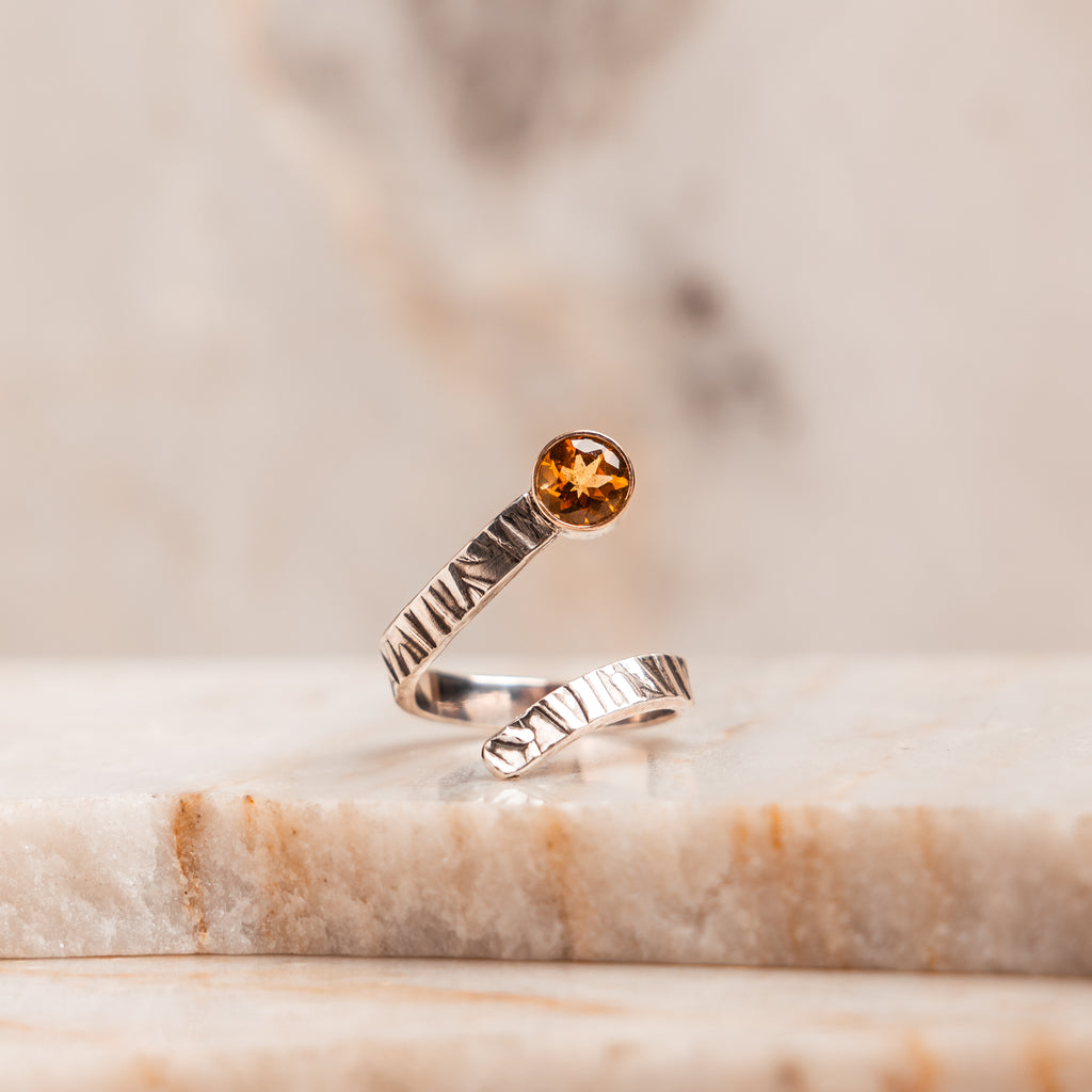 Adjustable artisan ring – golden citrine gemstone with unique silver and gold design.