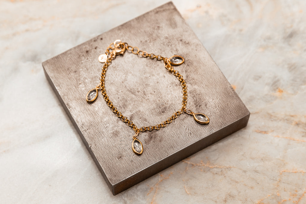 Timeless gold chain bracelet adorned with crystal quartz charms
