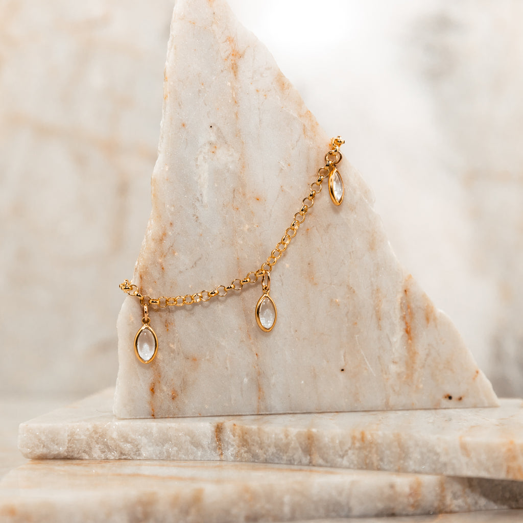 Dainty gold bracelet featuring sparkling crystal quartz