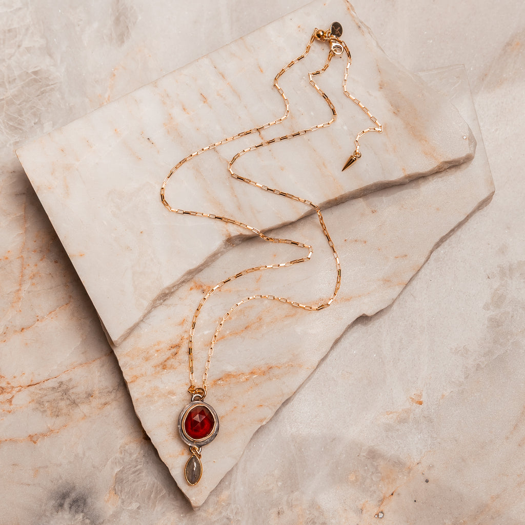 Boho luxe garnet and labradorite necklace with gold and oxidized silver for modern women.