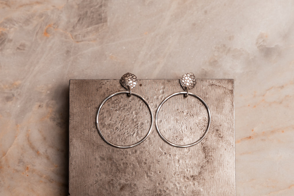 Bold yet lightweight silver earrings for the modern woman’s capsule wardrobe