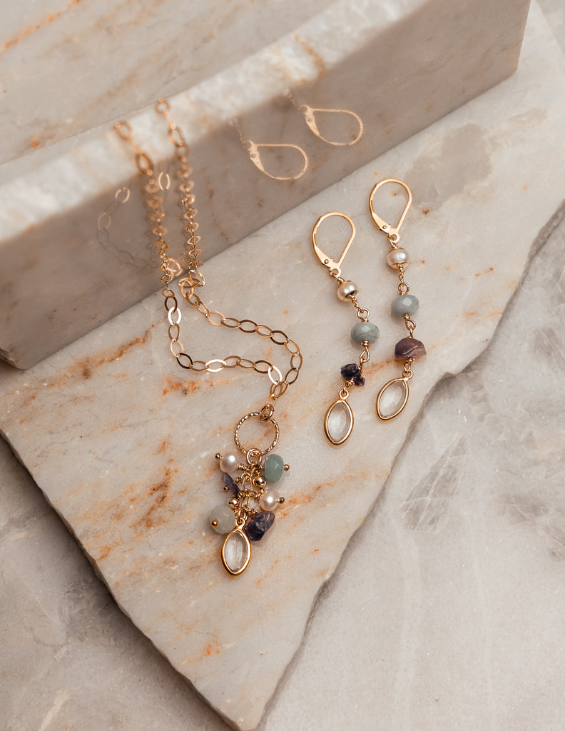 gold gemstone necklace and earrings