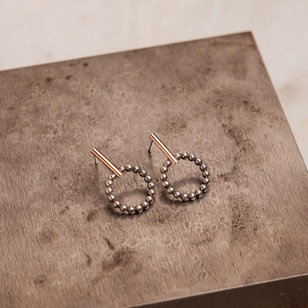 Minimalist earrings for daily wear, featuring a clean, contemporary silhouette and artisan-made charm