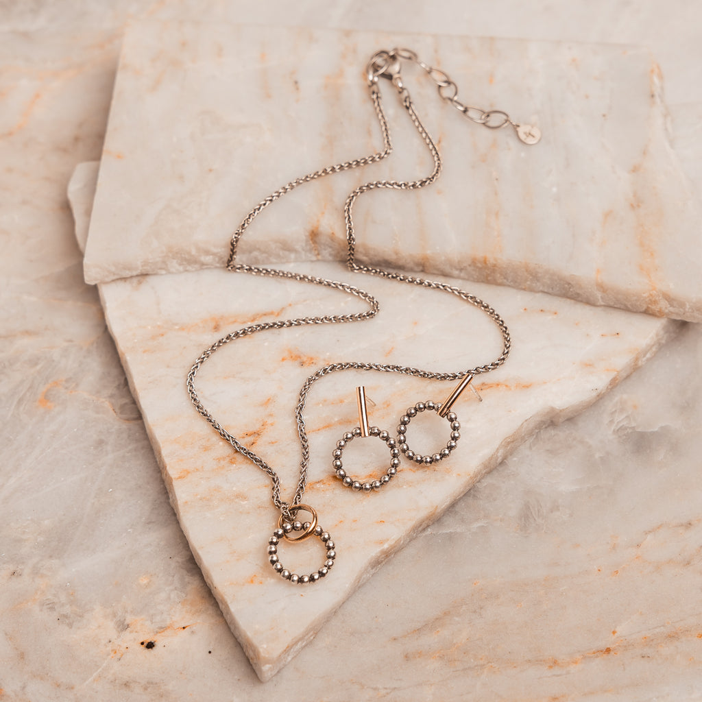 Thoughtful gift idea for her featuring minimalist circle earrings made by hand