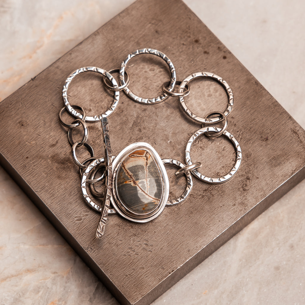 Statement gemstone bracelet – dendritic rhyolite jasper set in hand hammered silver.