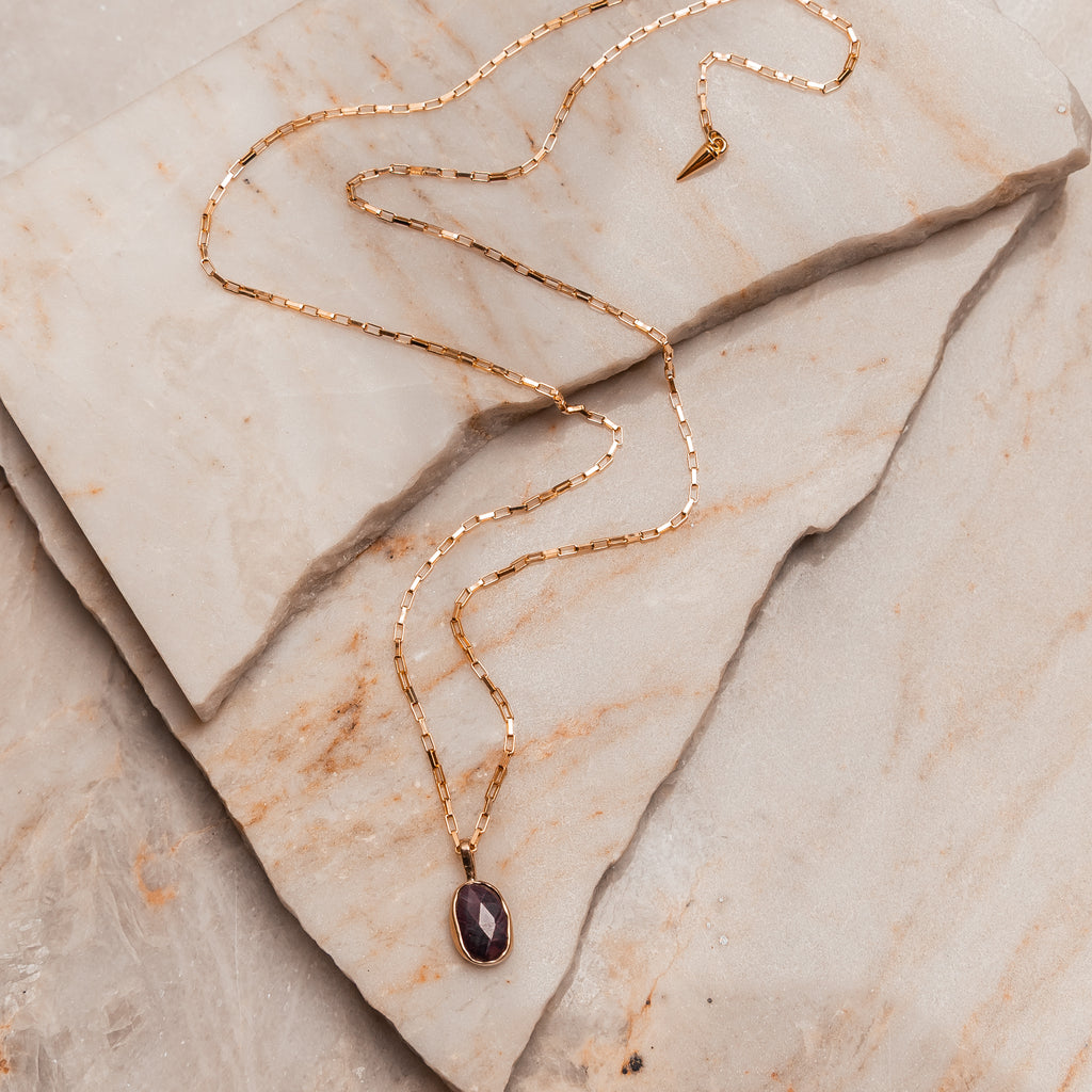 Minimalist ruby gemstone pendant necklace with gold and sterling silver for everyday luxury style.