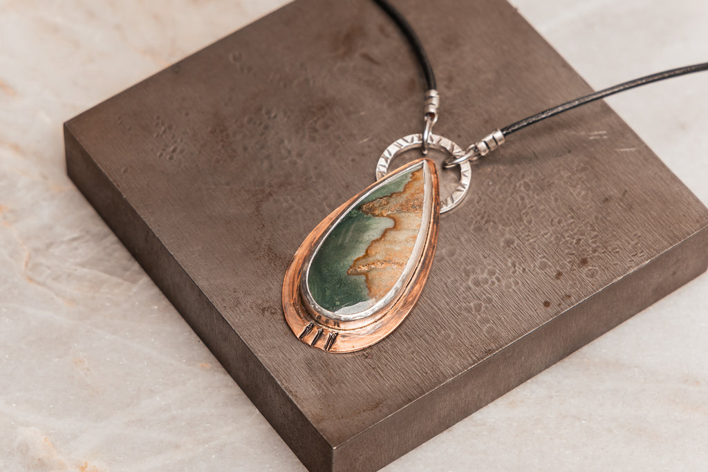 Rustic boho statement necklace featuring landscape jasper and hand-forged copper on leather cord