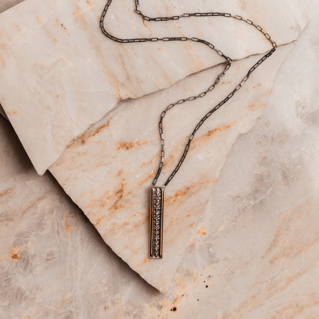 Handcrafted Chelsea Necklace with elegant metalwork and adjustable sterling silver chain, perfect for timeless style.
