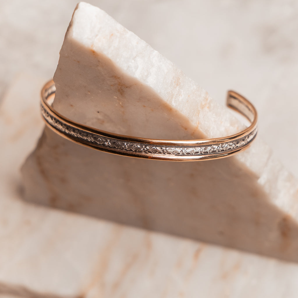 Luxury handmade cuff bracelet with a timeless design, crafted in sterling silver and gold-filled accents.