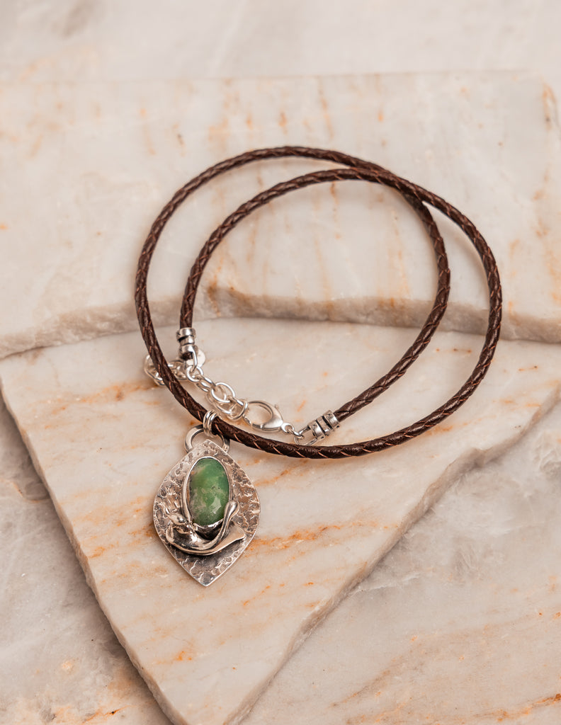 Earthy chrysoprase necklace with sculptural silver pendant and adjustable braided leather cord, designed for laid-back luxury