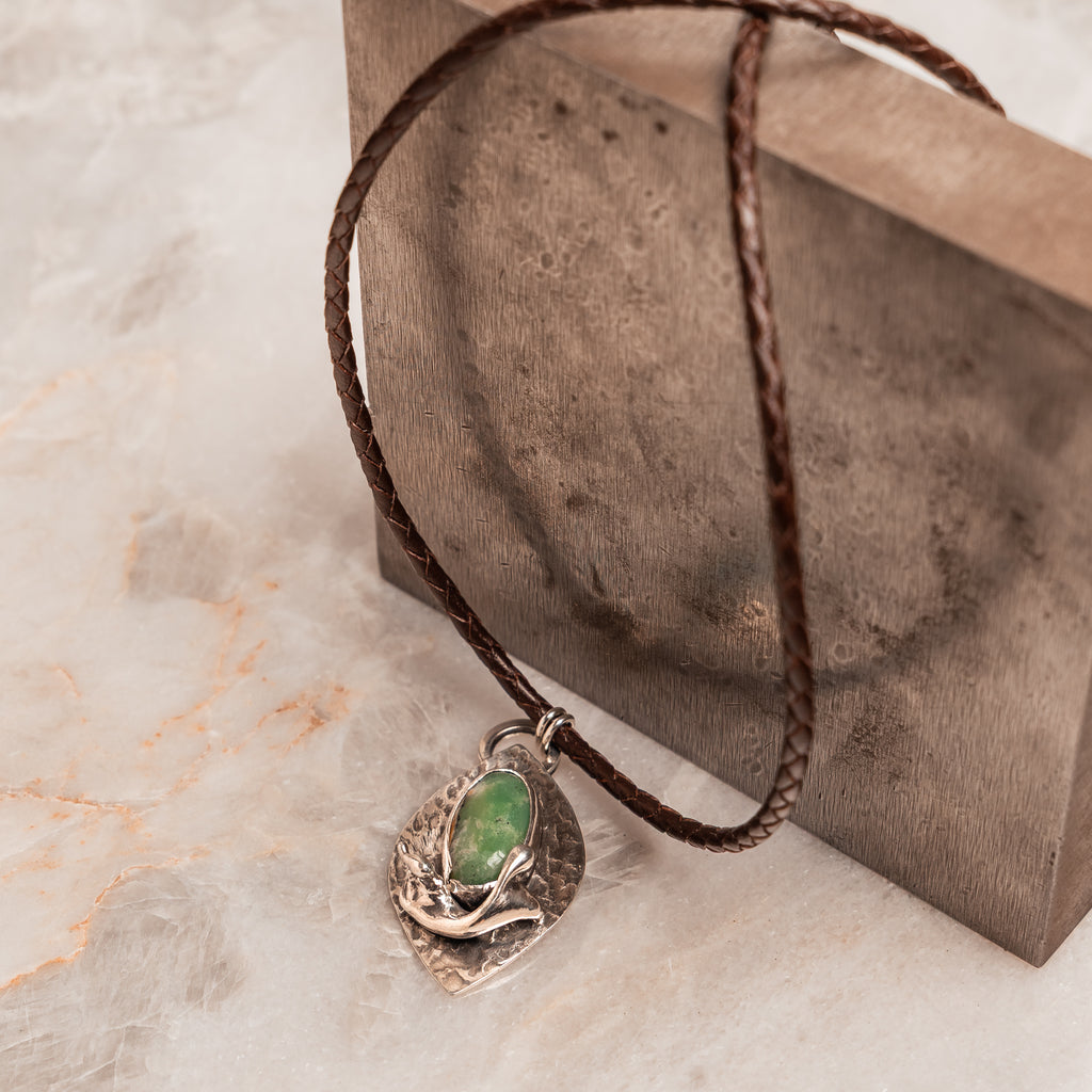 Handcrafted pendant necklace with organic cast silver embellishment and natural green chrysoprase, perfect for artisan jewelry lovers