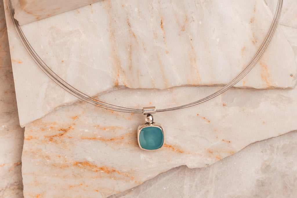 Unique tourmaline necklace – stainless steel neck wire with cyan gemstone pendant.