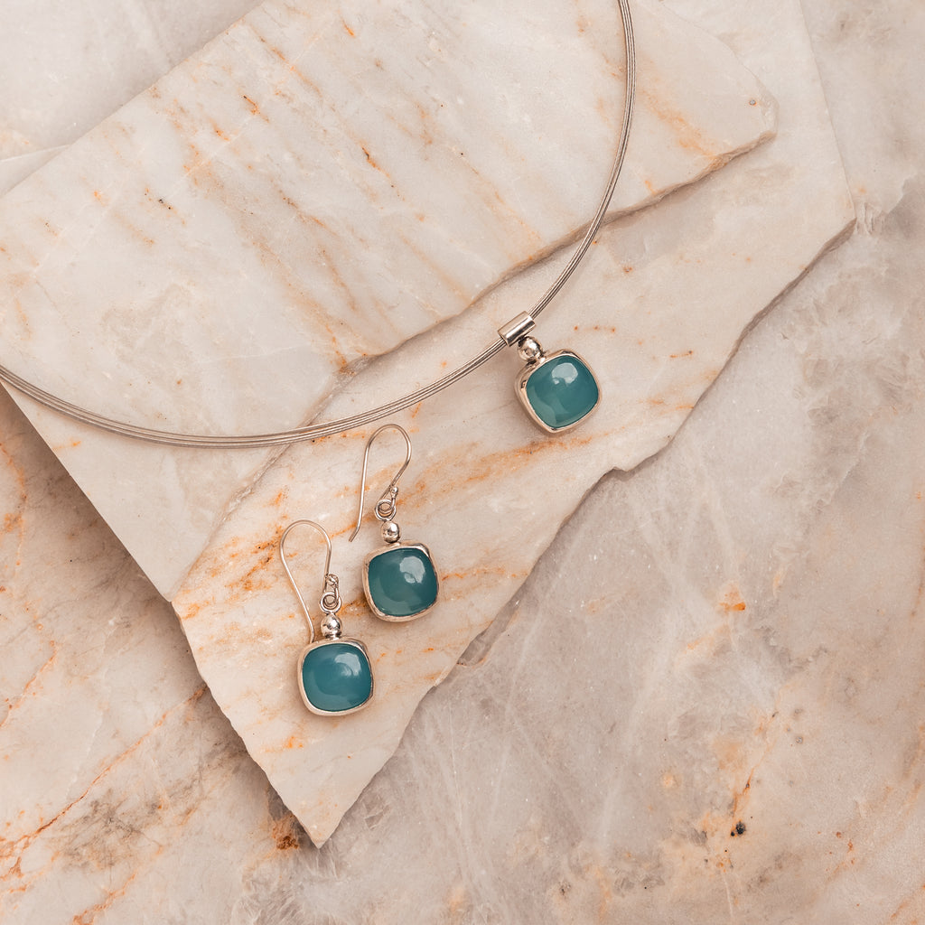 Handcrafted necklace with vivid cyan paraiba tourmaline set in sterling silver.