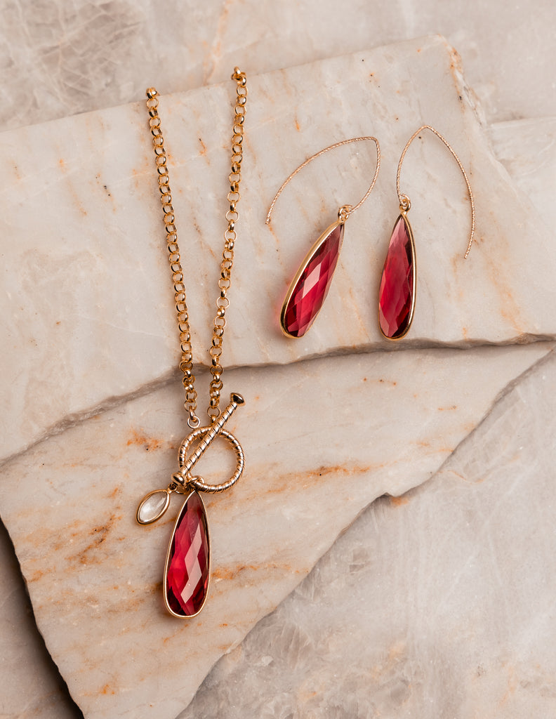 Artisan-crafted gold necklace with colorful gemstone accents inspired by Greek islands