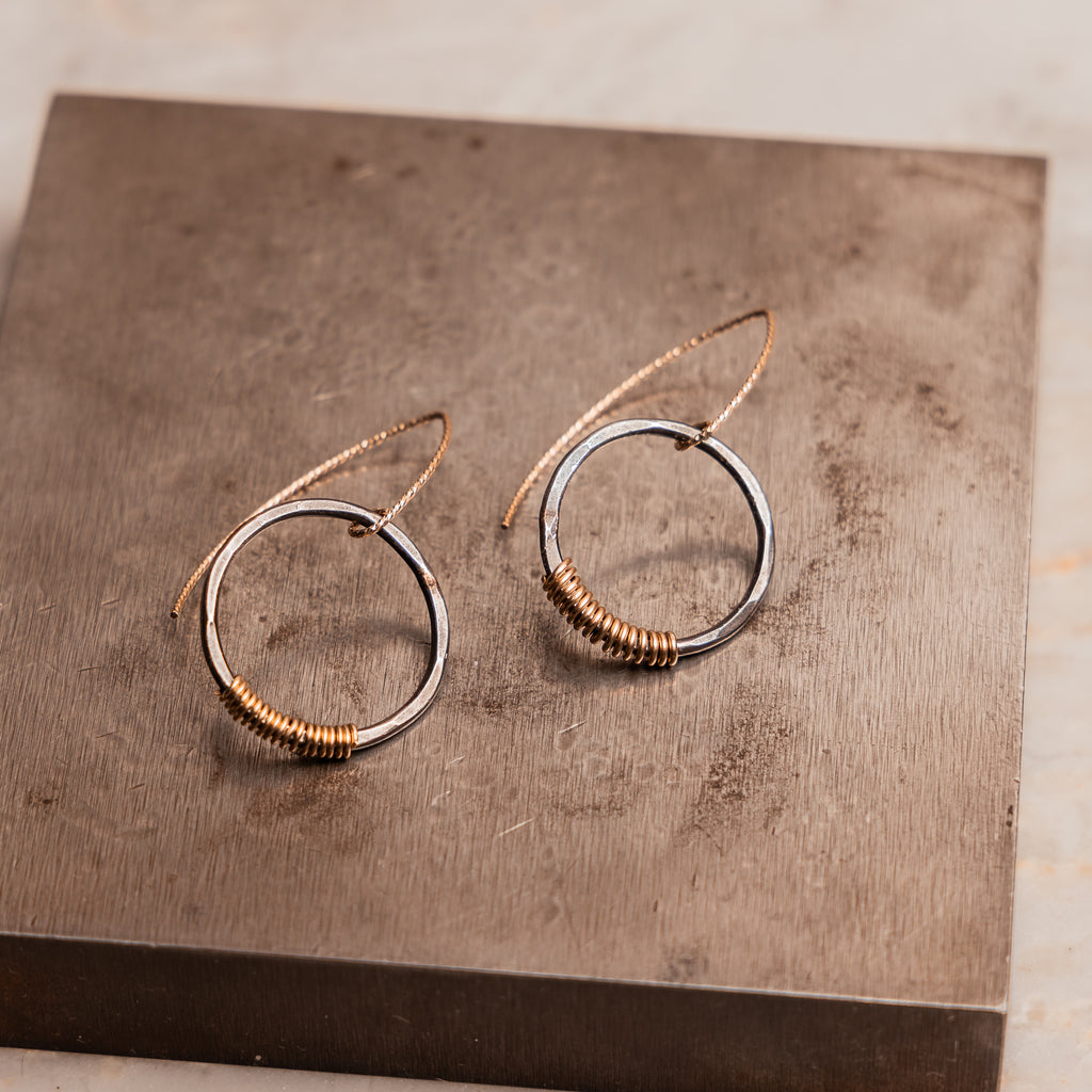 Modern artisan earrings with mixed metals and handcrafted texture