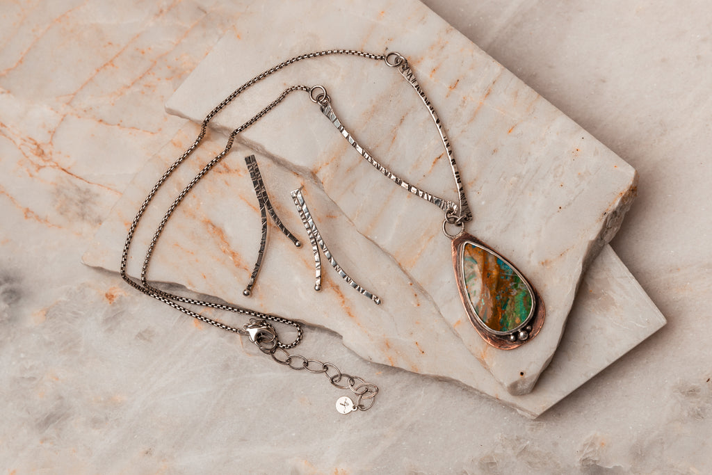 Hand-forged sophistication: Explore the rustic charm of our Peruvian Blue Opal Pendant Necklace. #RusticStyle #ArtisanCraftsmanship