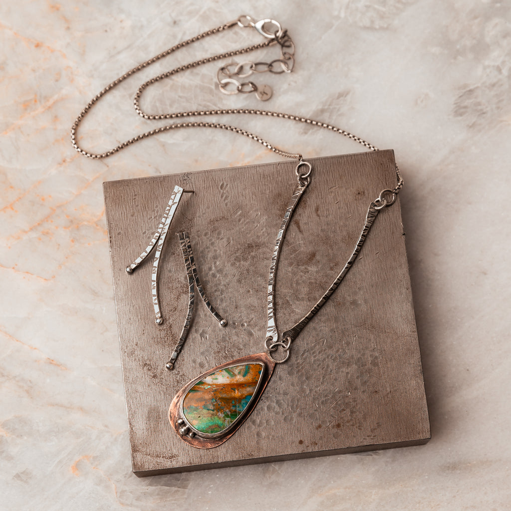 Hand-forged sophistication: Explore the rustic charm of our Peruvian Blue Opal Pendant Necklace. #RusticStyle #ArtisanCraftsmanship