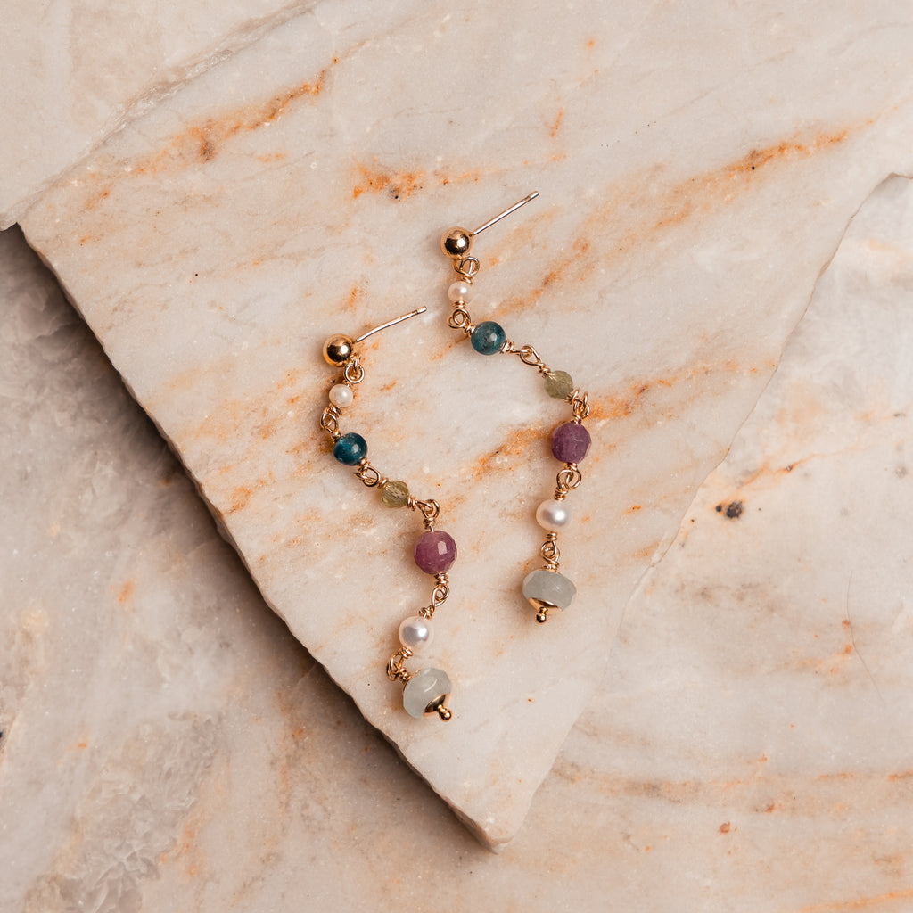 Artisan gemstone drop earrings – handmade with ruby, pearl, sodalite, and aquamarine.