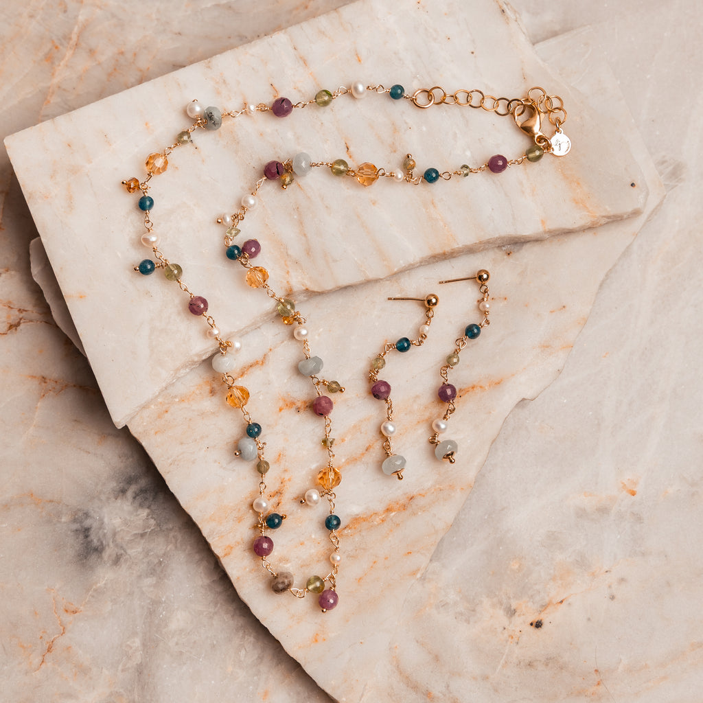 Elegant bohemian luxe earrings – long gold filled posts with vibrant gemstones.