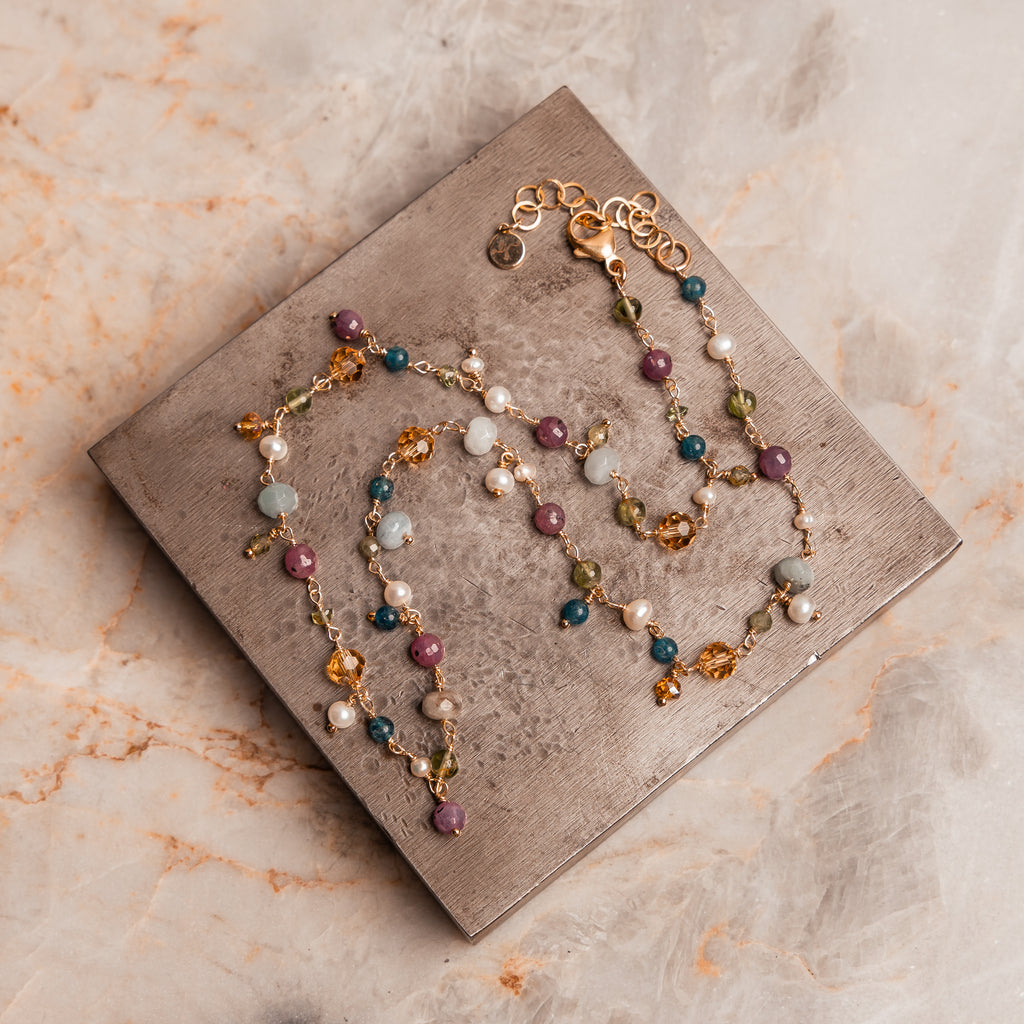 Happiness-inspired jewelry – Felicity Necklace with ruby, peridot, aquamarine, pearl, and sodalite.
