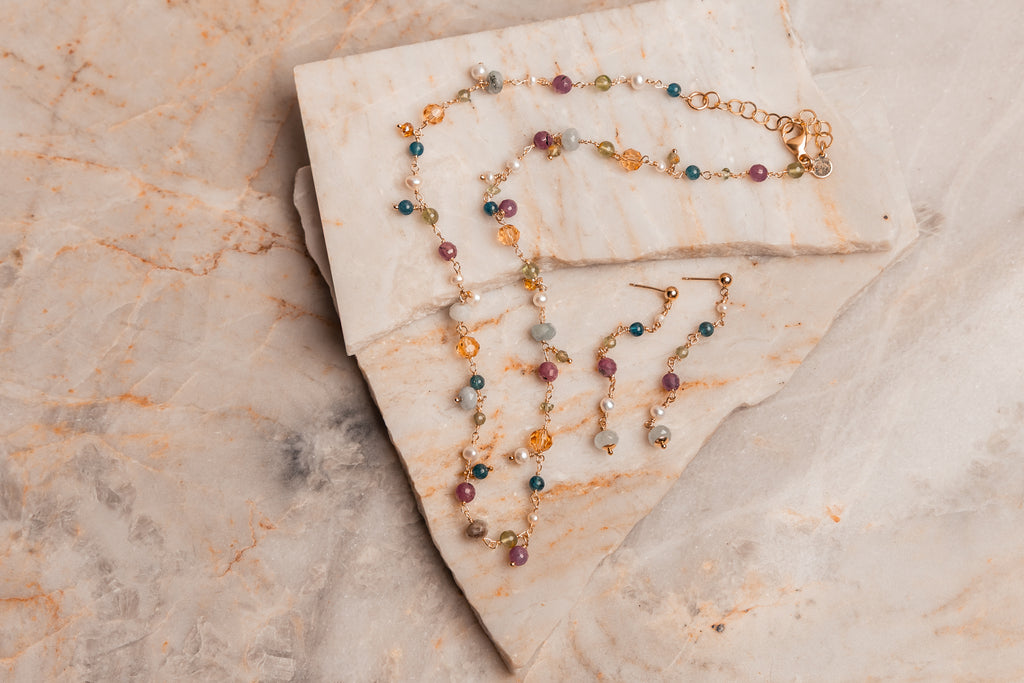Gift for her – artisan gemstone earrings in ruby, pearl, aquamarine, and sodalite.