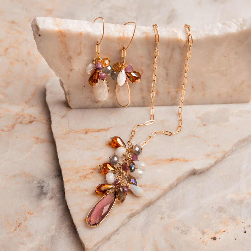 Unique artisan jewelry – handcrafted earrings with moonstone teardrops and rubies.