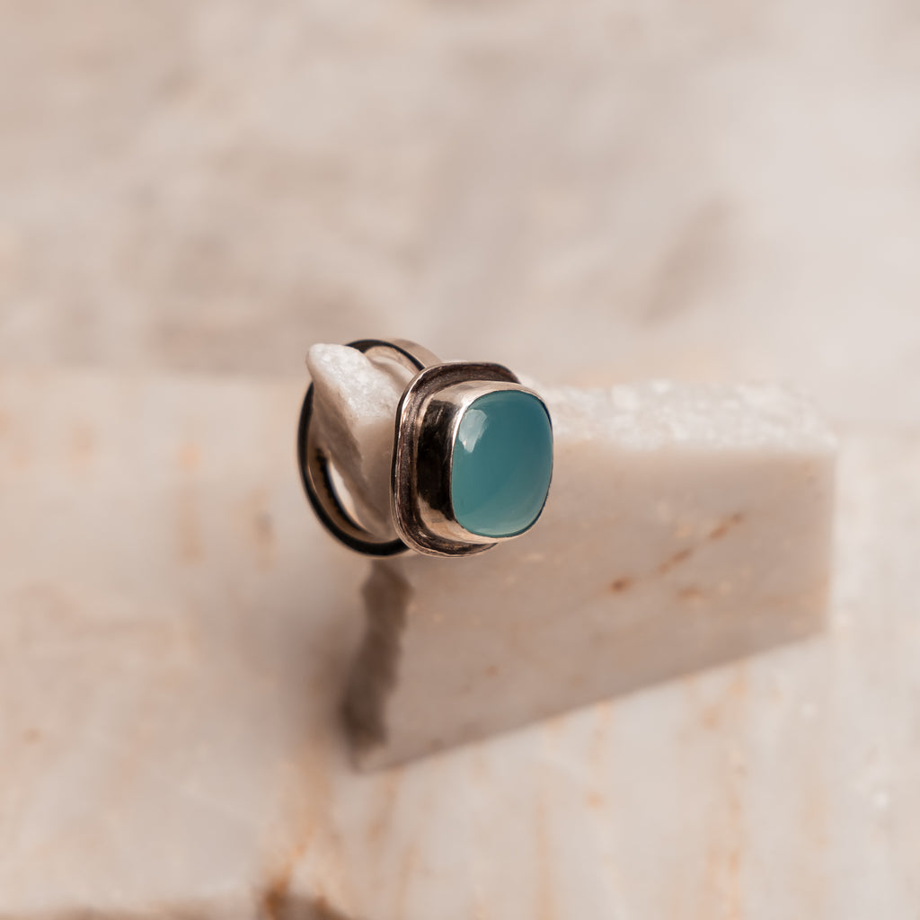 Artisan-made silver ring with eye-catching square Paraiba agate centerpiece in sleek setting