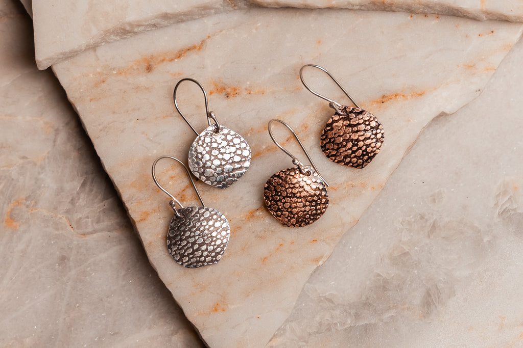 Artisan-crafted lightweight earrings for women, shown in both copper and silver with rustic finish.