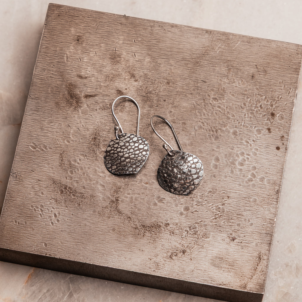 Lightweight artisan earrings with hand-embossed finish, perfect for boho chic and casual luxe looks.