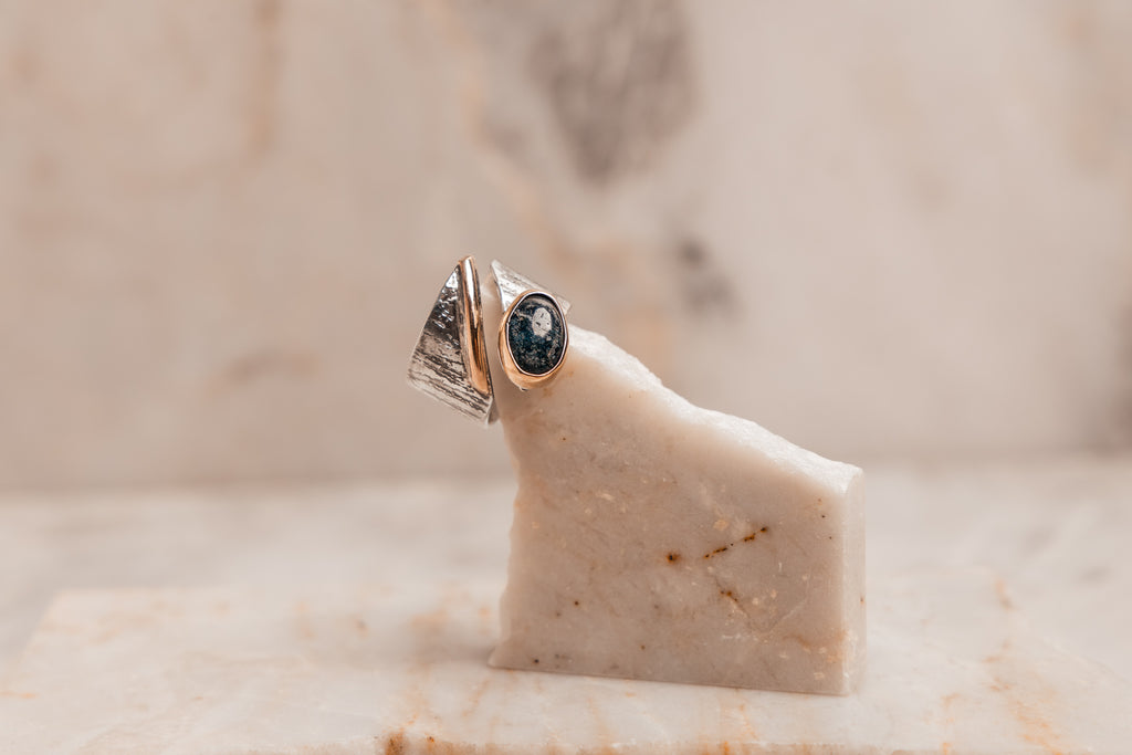 High-end handcrafted ring with mixed metal construction and natural gemstone, ideal for bold styling and meaningful gifting