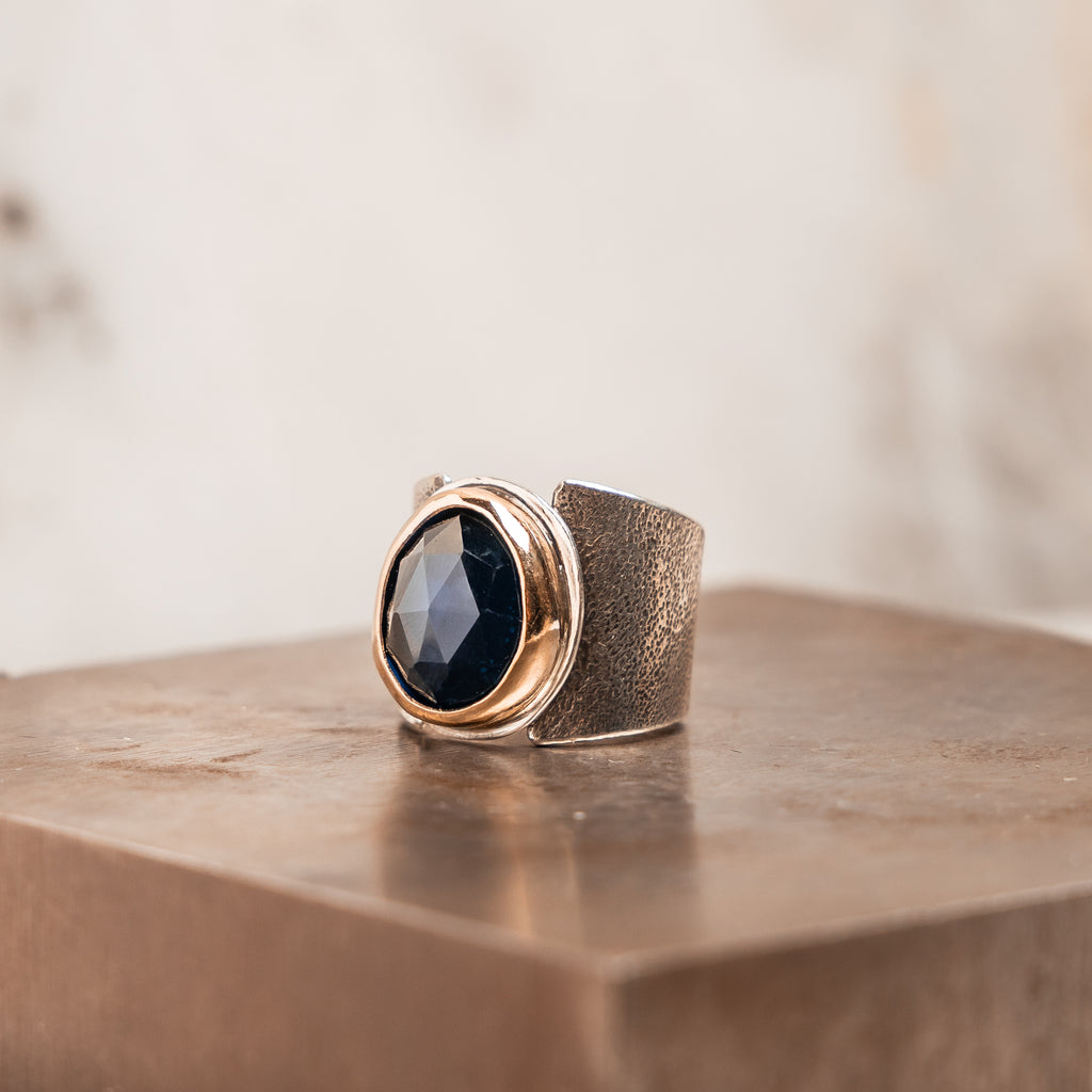 Heirloom-quality statement ring – London Blue topaz gemstone with embossed silver band.