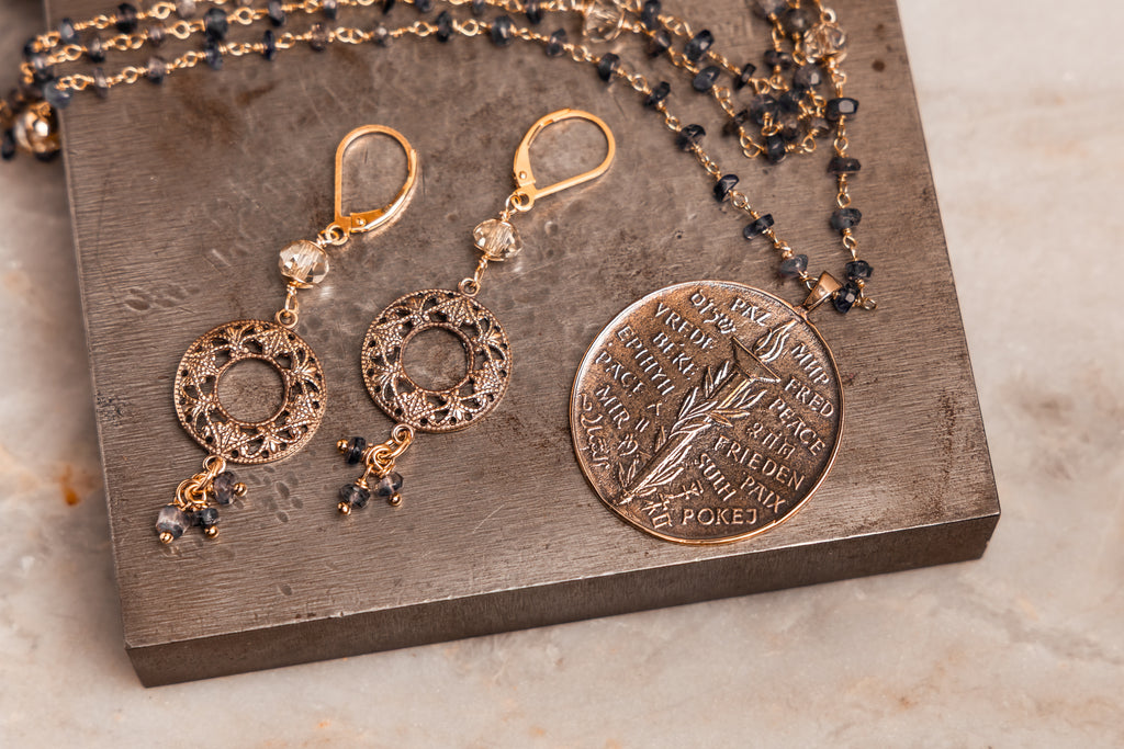 Elegant artisan earrings – champagne faceted beads with iolite gemstone clusters.