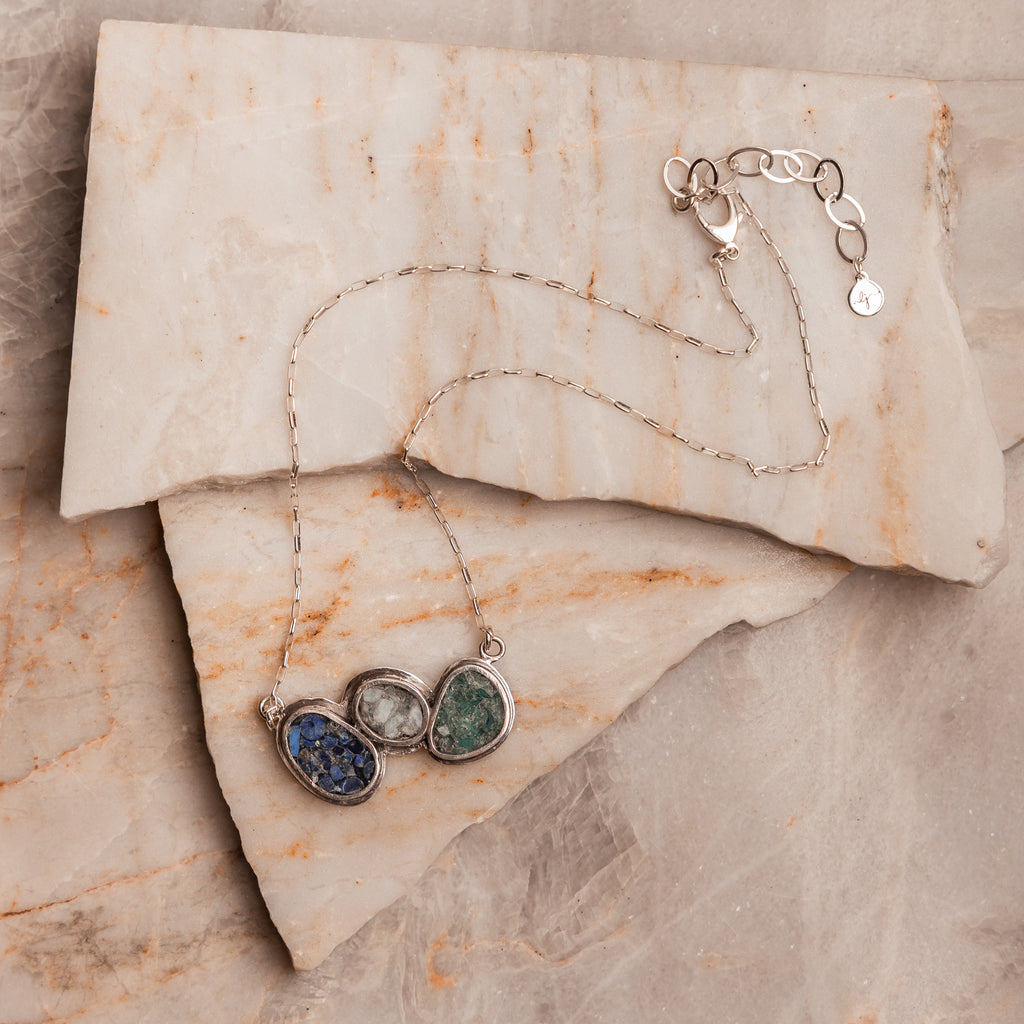 Lightweight artisan necklace with symbolic stones and handcrafted silver setting for everyday elegance