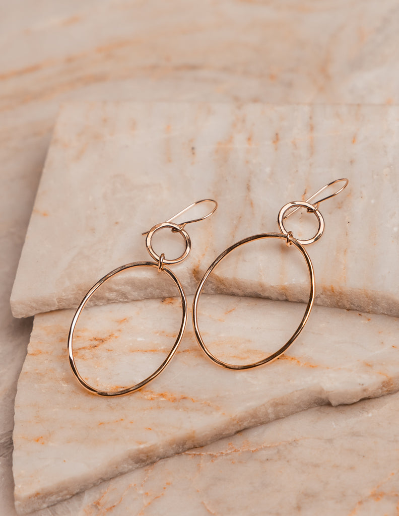 Minimalist double hoop earrings with hammered gold finish, handcrafted for modern elegance