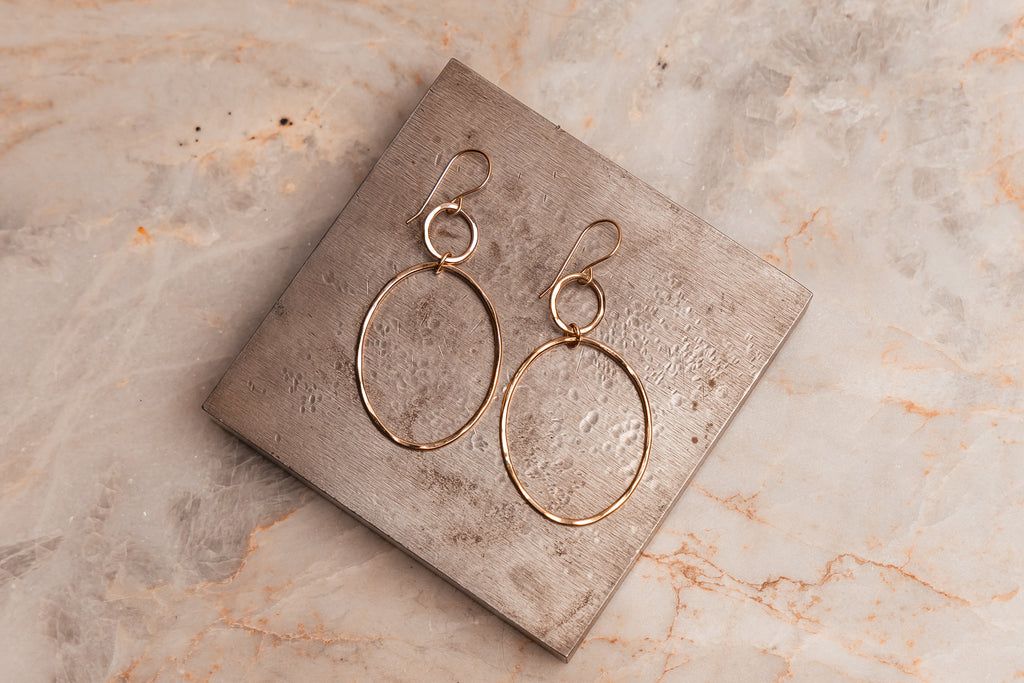 Elegant hand-hammered gold hoop earrings, ideal for gifting or everyday sophistication