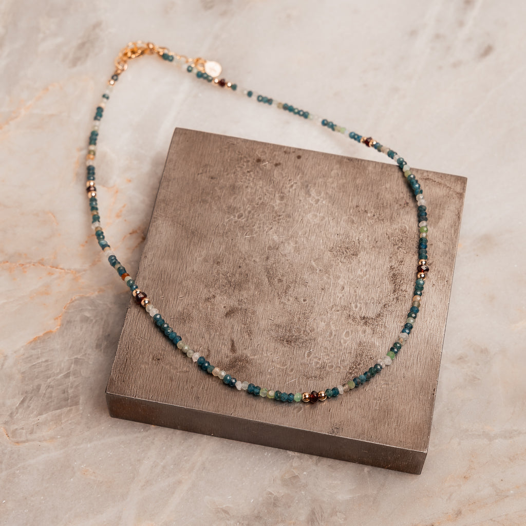 “Unique layering necklace with natural stones and gold accents for a modern boho look”