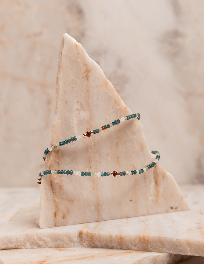 “Boho-chic artisan necklace with small beads for layering or solo styling”