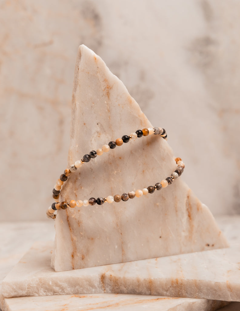 “Boho-chic artisan necklace with small beads for layering or solo styling”