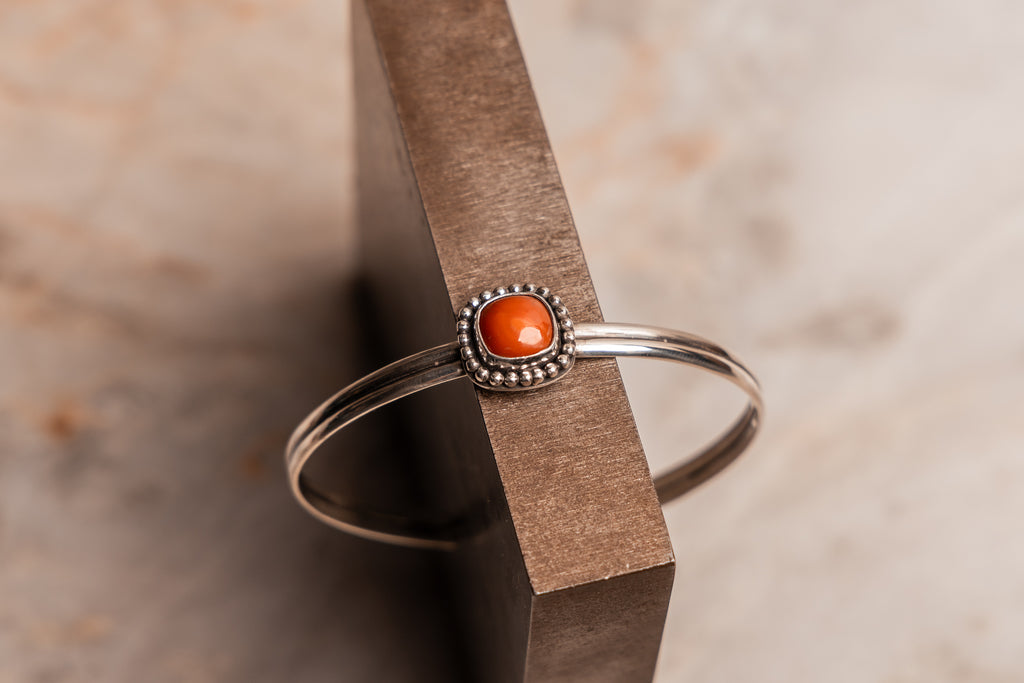 Rustic silver cuff with fiery gemstone, handcrafted in North Texas