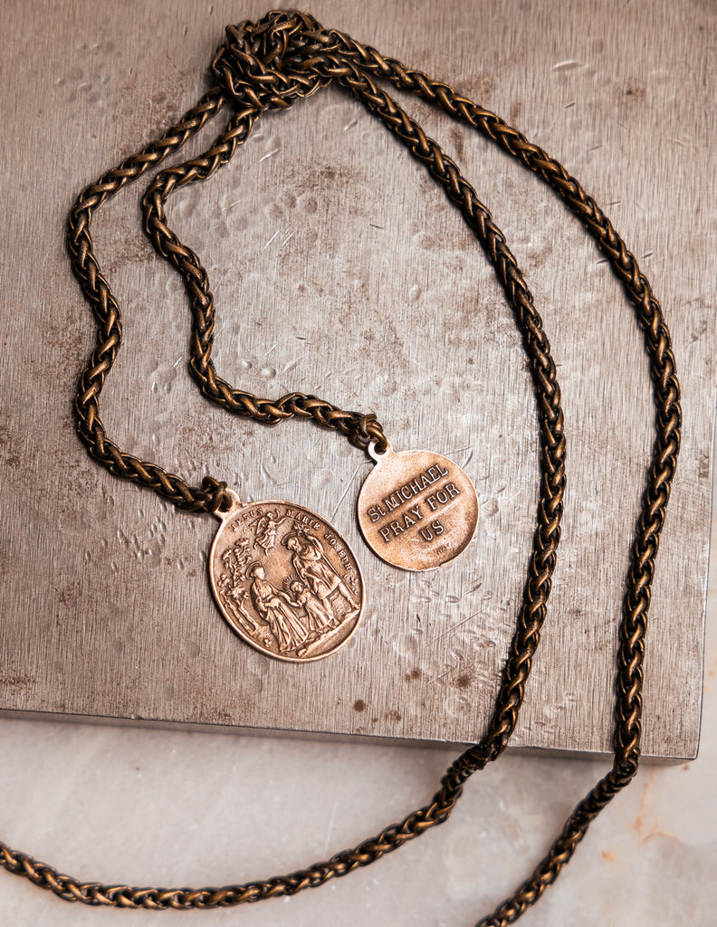 Versatile lariat necklace with antique brass chain and Holy Family & St. Michael medals