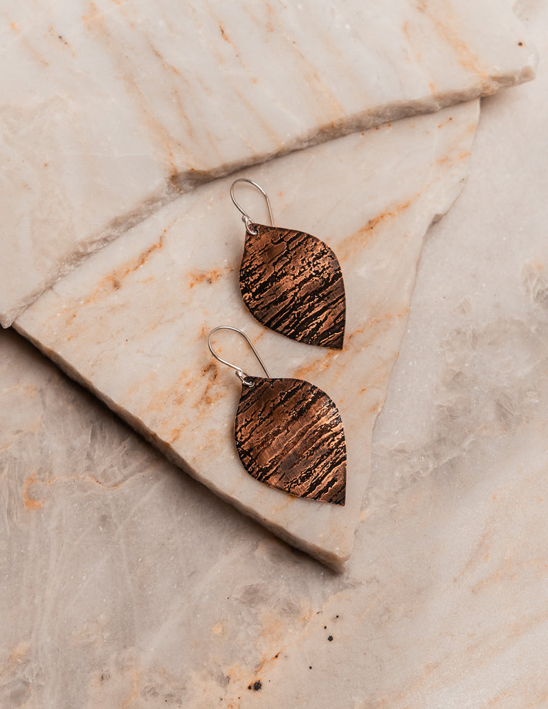 Elevated boho style earrings with handcrafted copper design and luxe silver finishing