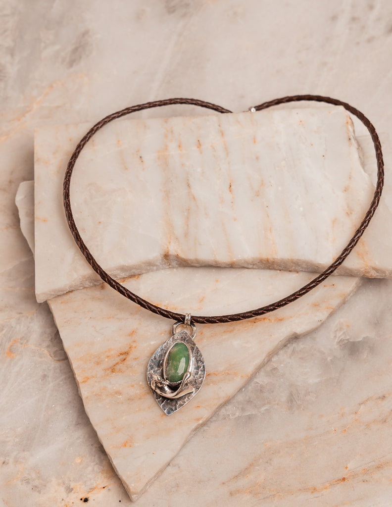 Statement leather cord necklace with chrysoprase gemstone and textured silver, combining rustic charm with elevated design