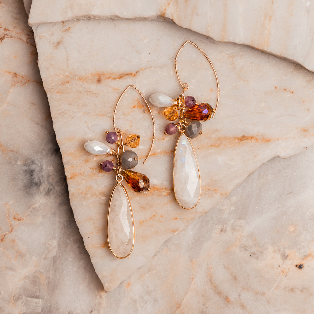 Rainbow moonstone earrings – faceted teardrops with ruby and gemstone accents.
