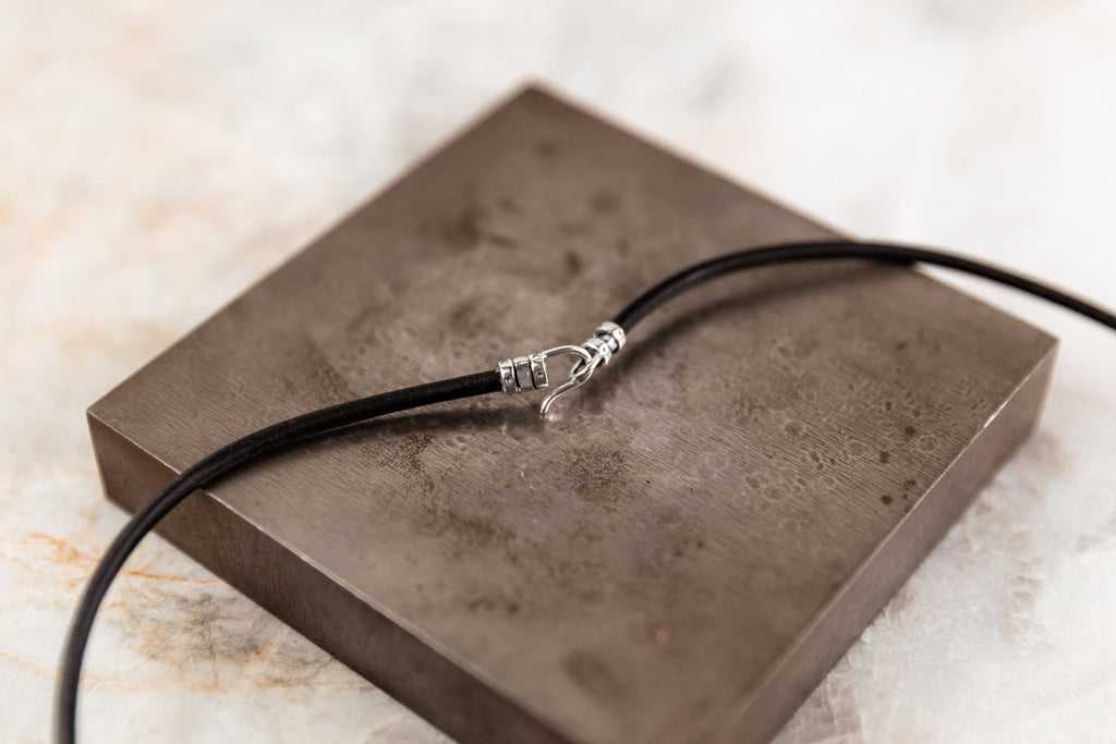silver cross on leather necklace for men